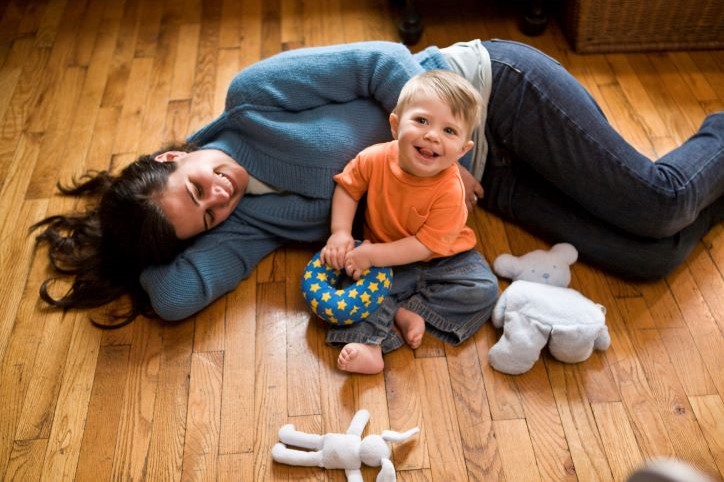 mom and toddler on wood floor